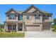 Stunning two story home with stone and siding accents, and three car garage at 1600 Kamp Springs Ave, Lawrenceville, GA 30045