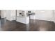 Open concept kitchen flowing into dining area with island, granite counters and stainless appliances at 1600 Kamp Springs Ave, Lawrenceville, GA 30045