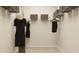 Well-organized walk-in closet with ample hanging space and storage boxes at 2450 Cotton Ln, Douglasville, GA 30135