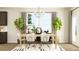 Bright dining area with a light wood table, seating for four, modern chandelier, and stylish decor at 2450 Cotton Ln, Douglasville, GA 30135