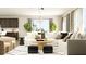 Bright living room featuring a modern chandelier, plush seating, and stylish decor at 2450 Cotton Ln, Douglasville, GA 30135