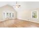 Spacious bedroom featuring a bay window, hardwood floors, and a ceiling fan at 639 Ladora Dr, Dallas, GA 30157