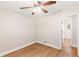 Bedroom featuring a ceiling fan, wood floors, and a view into another room at 639 Ladora Dr, Dallas, GA 30157