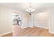 Dining area with hardwood floors and chandelier lighting at 639 Ladora Dr, Dallas, GA 30157