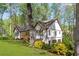 Exterior view of a charming home with white siding, brown trim, and a well-maintained lawn at 639 Ladora Dr, Dallas, GA 30157