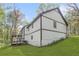 Beautiful two-story home with a deck, a walkout basement, and a lush green lawn at 639 Ladora Dr, Dallas, GA 30157