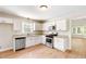 Bright kitchen features stainless steel appliances, granite countertops, and modern cabinetry at 639 Ladora Dr, Dallas, GA 30157