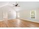 Open living room featuring vaulted ceilings, modern ceiling fan, hardwood floors, and lots of natural light at 639 Ladora Dr, Dallas, GA 30157