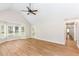 Bright living room with hardwood floors, a ceiling fan, and multiple windows that provide natural light at 639 Ladora Dr, Dallas, GA 30157