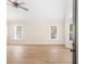 Spacious living room with hardwood flooring, large windows, and an open layout perfect for entertaining at 639 Ladora Dr, Dallas, GA 30157