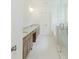 Bathroom featuring double vanities, large glass shower, and neutral decor at 6585 Rhett Run, Cumming, GA 30028