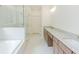 Spacious bathroom features double sinks, a glass shower, and a soaking tub at 6585 Rhett Run, Cumming, GA 30028
