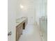 The bathroom has a double vanity with granite countertops and a glass-enclosed shower at 6585 Rhett Run, Cumming, GA 30028