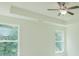 Spacious bedroom featuring large windows, recessed ceiling and a ceiling fan at 6585 Rhett Run, Cumming, GA 30028