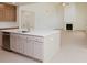 Modern kitchen features stainless steel appliances, a spacious island, and an open floor plan at 6585 Rhett Run, Cumming, GA 30028
