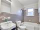 Bathroom features bathtub, toilet, and vanity with ample counter space at 108 Glenn St, Decatur, GA 30030