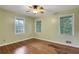 Bedroom boasts hardwood floors and natural light through its large windows, offering a bright and airy feel at 108 Glenn St, Decatur, GA 30030