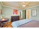 Bedroom with a ceiling fan, hardwood floors, and a spacious closet, creating a comfortable retreat at 108 Glenn St, Decatur, GA 30030