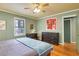 Bedroom with hardwood floors, ceiling fan, neutral wall color, and a large dresser at 108 Glenn St, Decatur, GA 30030