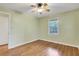 Empty bedroom featuring hardwood floors and a window offering natural light creating a bright space at 108 Glenn St, Decatur, GA 30030