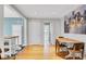 Bright dining area featuring hardwood floors, modern lighting, and an adjacent kitchen at 108 Glenn St, Decatur, GA 30030