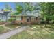 Charming brick home with mature trees, walkway, and inviting curb appeal at 108 Glenn St, Decatur, GA 30030