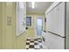 Classic kitchen featuring black and white checkered floors, a vintage stove, and ample natural light at 108 Glenn St, Decatur, GA 30030