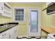 Practical kitchen with a double sink, exterior access, and a vintage-inspired design at 108 Glenn St, Decatur, GA 30030