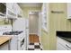 Efficient kitchen with appliances and checkered flooring, offering functionality and charm at 108 Glenn St, Decatur, GA 30030