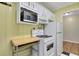 Functional kitchen features gas stove, oven, and microwave maximizing space at 108 Glenn St, Decatur, GA 30030