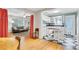 Open concept kitchen with white cabinets, checkerboard floors, flowing into the living room at 108 Glenn St, Decatur, GA 30030