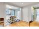 Open concept kitchen with white cabinets, checkerboard floors, flowing into the dining room at 108 Glenn St, Decatur, GA 30030