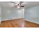 Light-filled living room with hardwood floors and ceiling fan, blending comfort and classic design at 108 Glenn St, Decatur, GA 30030