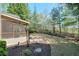 View of the back porch and backyard that features a fence and fresh landscaping at 206 Mountain Vista Blvd, Canton, GA 30115
