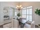 Dining room boasts natural light, classic wainscoting, and an elegant chandelier perfect for Gathering gatherings at 206 Mountain Vista Blvd, Canton, GA 30115