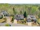 Aerial view of the homes on a tree-lined street with well-manicured lawns at 206 Mountain Vista Blvd, Canton, GA 30115