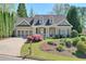 Charming single-story home featuring a well-manicured lawn and a two-car garage at 206 Mountain Vista Blvd, Canton, GA 30115