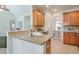 Bright kitchen features granite countertops, a modern sink, and seamlessly integrates with the adjacent dining area at 206 Mountain Vista Blvd, Canton, GA 30115