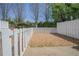 Enclosed backyard with stone ground cover, offering a private and low-maintenance outdoor area at 392 Mill Pond Cossing, Carrollton, GA 30116