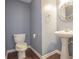Elegant powder room with pedestal sink and classic design at 392 Mill Pond Cossing, Carrollton, GA 30116