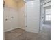 Neutral bonus room with carpet flooring, a utility sink, and access to other rooms at 392 Mill Pond Cossing, Carrollton, GA 30116