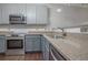 Close up of a modern kitchen featuring stainless steel appliances and granite countertops at 392 Mill Pond Cossing, Carrollton, GA 30116