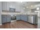 Well-equipped kitchen with stainless steel appliances and countertops, plus ample storage at 392 Mill Pond Cossing, Carrollton, GA 30116
