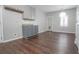 Bright kitchen with gray cabinets, granite countertops, and wood floors at 392 Mill Pond Cossing, Carrollton, GA 30116