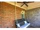 Relaxing back porch with swing, perfect for enjoying outdoor living at 636 Parkside Village Nw Way, Marietta, GA 30060