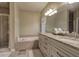 Luxurious bathroom with granite countertops, double vanity, and separate shower and tub at 636 Parkside Village Nw Way, Marietta, GA 30060