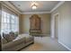 Cozy bedroom featuring a luxurious chaise lounge and a vintage-inspired armoire for ample storage at 636 Parkside Village Nw Way, Marietta, GA 30060