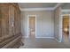 Bedroom with a view to the bathroom and hallway, featuring decorative trim and a large, decorative cabinet at 636 Parkside Village Nw Way, Marietta, GA 30060