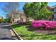 Landscaped community featuring manicured lawns and seasonal flowering bushes and shrubs at 636 Parkside Village Nw Way, Marietta, GA 30060