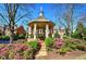 Community gazebo with landscaped flower beds and well-maintained surroundings at 636 Parkside Village Nw Way, Marietta, GA 30060